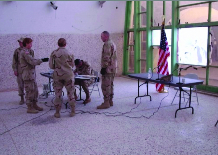 U.S. Army Courtroom, Kandahar Airfield, Kandahar,
        Afghanistan, in 2003/2004. Paralegals from
        1/10 MTN DIV, located, cleaned, and created the
        “courtroom” in the passenger terminal of the
        Kandahar International Airport. They defended the
        courtroom from feral dogs the night before trial
        and tried to improve acoustics by fixing blown-out
        windows with duct tape and clear trash bags. The
        trial counsel of record are thankful to their
        dedication. Pictured left to right: SGT Nick Taylor,
        paralegal NCOIC, 1/10 MTN DIV (LI); CPT Kasia (Krul)
        Stich, trial counsel, 1/10 MTN DIV (LI); CPT Marie
        Anderson, chief, operational law, 10th MTN DIV (LI);
        CPT Joseph Orenstein, defense counsel. Seated: LTC
        Stephen Henley, military judge. Not pictured: SPC
        Diego Echeverri, paralegal. (Photo courtesy of COL
        Anderson & COL Stich)